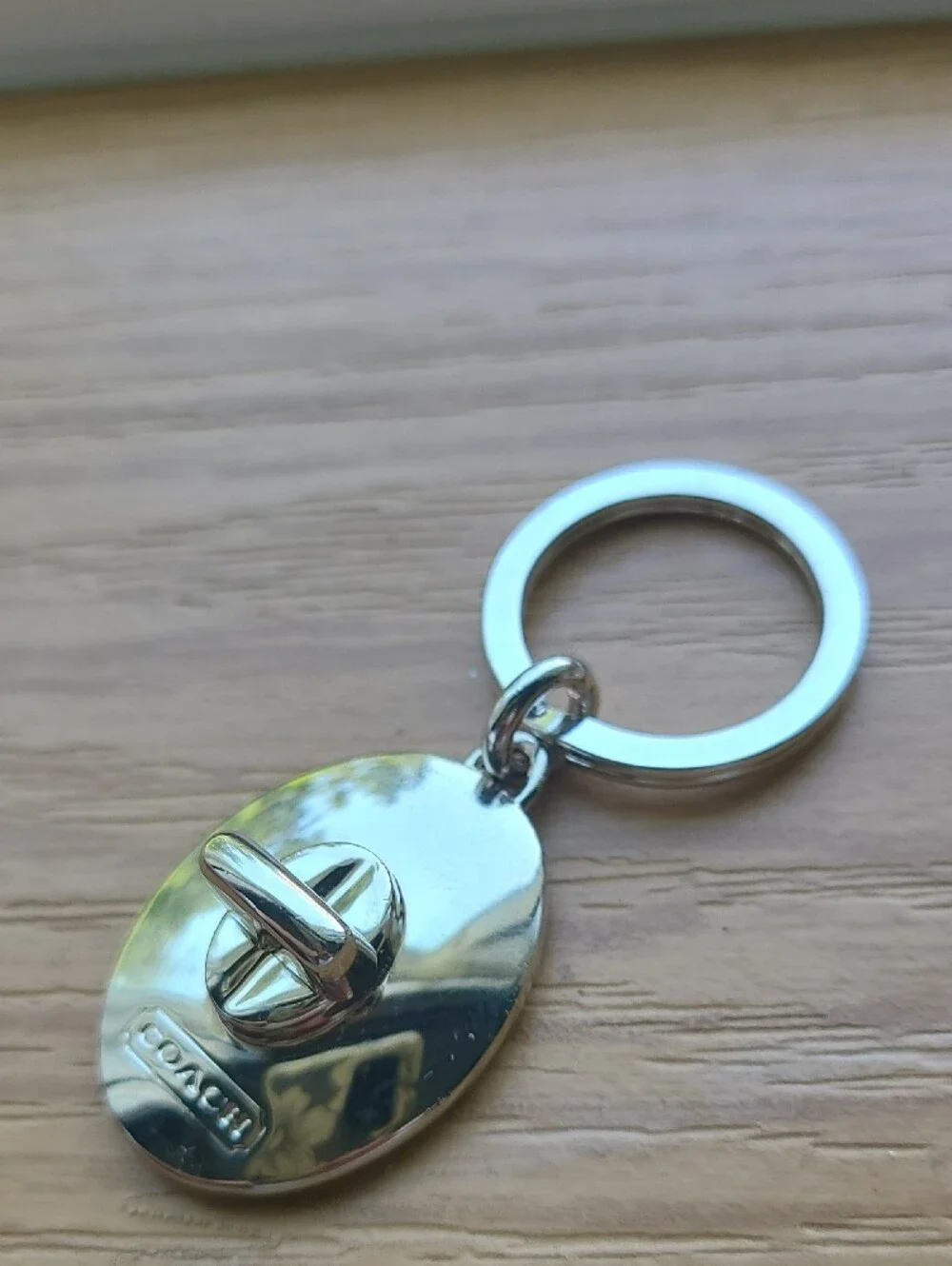 Coach Silver Oval Turnlock Keyring